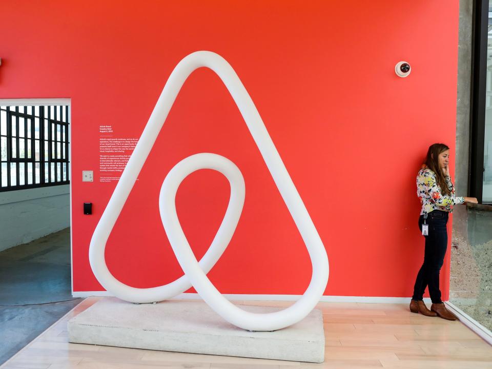 FILE PHOTO: A woman talks on the phone at the Airbnb office headquarters in the SOMA district of San Francisco, California, U.S., August 2, 2016.  REUTERS/Gabrielle Lurie