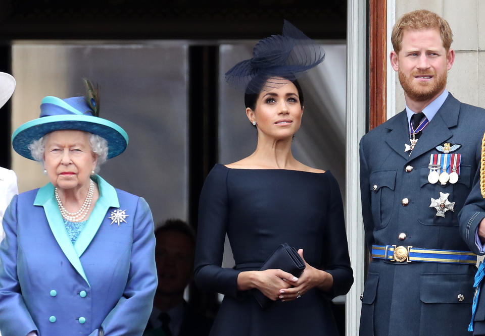 LONDON, ENGLAND - JULY 10: Queen Elizabeth II, Prince Harry, Duke of Sussex and Meghan, Duchess of Sussex on the balcony of Buckingham Palace as the Royal family attend events to mark the Centenary of the RAF on July 10, 2018 in London, England. (Photo by Chris Jackson/Getty Images)