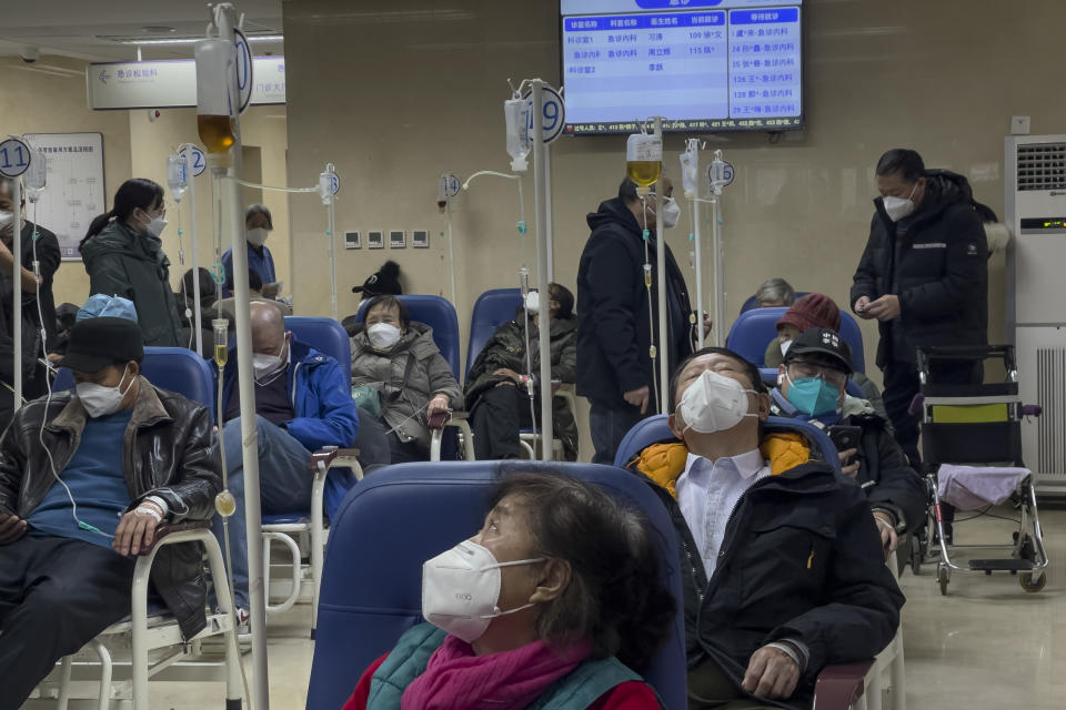 Patients receive intravenous drips at the emergency ward of a hospital in Beijing, Thursday, Jan. 5, 2023. Patients, most of them elderly, are lying on stretchers in hallways and taking oxygen while sitting in wheelchairs as COVID-19 surges in China's capital Beijing. (AP Photo/Andy Wong)