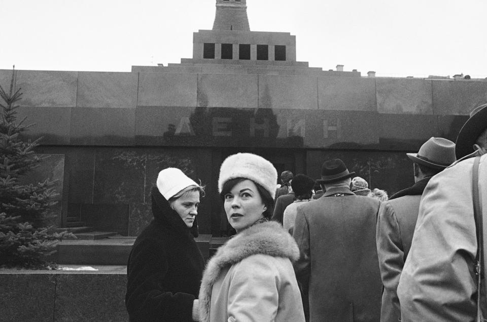 In this March 21, 1965, file photo, Shirley Temple, former child film star, waits in the line to visit Lenin's tomb in Red Square, in Moscow. Temple was in Moscow to consult Russian neurologists about her brother, who has multiple sclerosis. Temple, who died at her home near San Francisco, Monday, Feb. 10, 2014, at 85, sang, danced, sobbed and grinned her way into the hearts of Depression-era moviegoers and remains the ultimate child star decades later. (AP Photo/Brian Calvert, File)