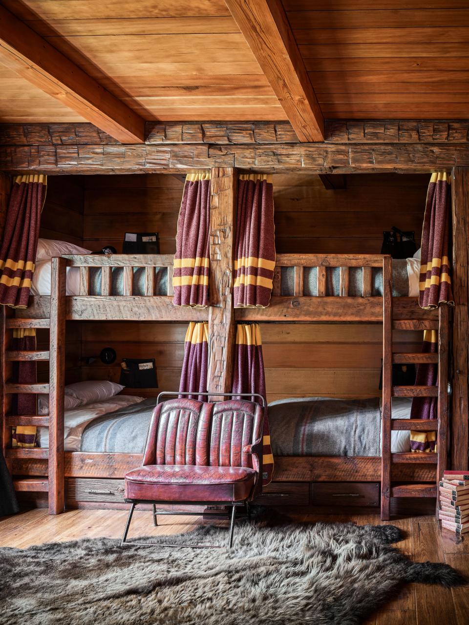 In the bunk room, bed curtains are fashioned from Faribault Woolen Mill Co. blankets.