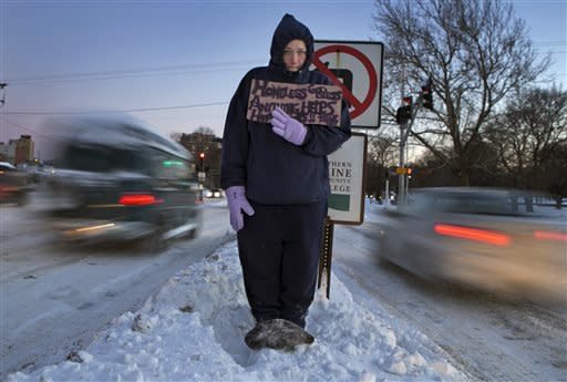 Many communities have <a href="http://nationalhomeless.org/references/directory/" target="_blank">emergency programs that serve the homeless and other vulnerable populations</a>. Stoops says that the best thing would be to arm yourself with as much information as possible about the various social services in your community (Where's the nearest shelter, for instance? Or what time does the neighborhood soup kitchen serve lunch?), so that you can offer this valuable information to the people you wish to help.  <br> <br> If, however, you don't have this information handy, or if you are unwilling, for whatever reason, to personally approach the person in question, then you should consider calling a local crisis hotline (<a href="http://www.forbes.com/sites/dandiamond/2014/01/04/how-to-help-the-homeless-when-it-gets-this-cold/" target="_blank">Forbes has a partial list of numbers you could call</a>) or 911.  <br> <br> <em>(In the photo above, 28-year-old Victoria Morris is pictured panhandling in Portland, Maine, where the temperature at dusk was 7 degrees Fahrenheit on Friday. Morris, who is homeless, finally sought shelter when she could no longer feel her toes, the AP reports.)</em>