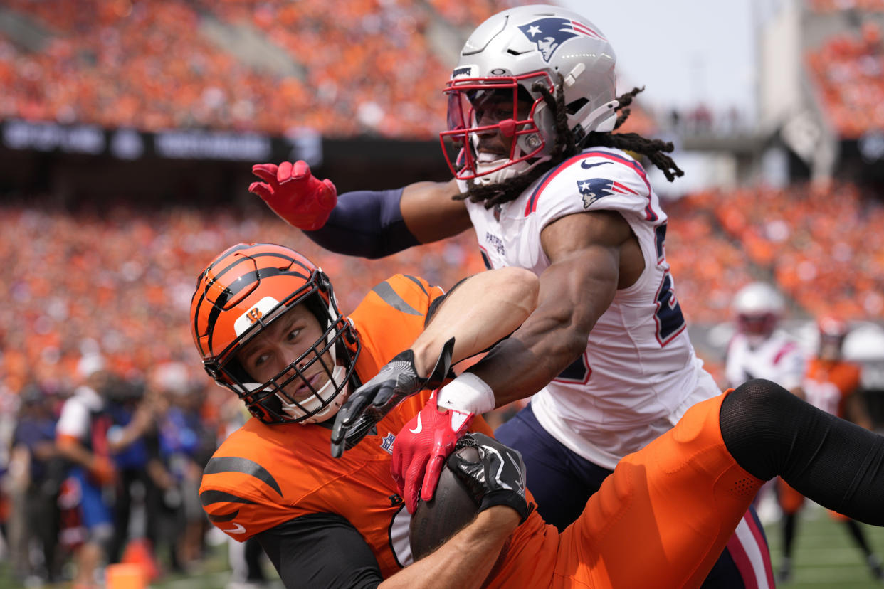 New England Patriots safety Kyle Dugger, right, breaks up a pass intended for Cincinnati Bengals tight end Mike Gesicki during the first half of an NFL football game, Sunday, Sept. 8, 2024, in Cincinnati. (AP Photo/Jeff Dean)