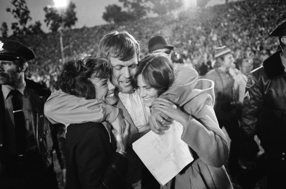 Coach Dick Vermeil of UCLA celebrates with his wife Carol, left, and daughter Nancy, 15, after his team upset Ohio State 23-10 in the Rose Bowl in Pasadena, California, Thursday, Jan 2, 1976. Unbeaten Ohio State was a heavy favorite.