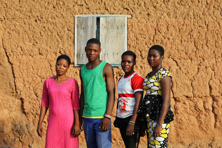 Two sets of non-identical twins Taiwo, Kehinde, Abigail and Deborah Daniel pose for a photograph in Igbo Ora, Oyo State, Nigeria April 3, 2019. PIcture taken April 3, 2019. REUTERS/Afolabi Sotunde