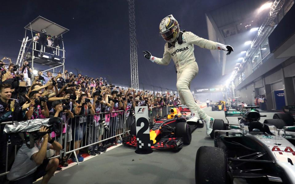 Lewis Hamilton celebrates his victory - AP
