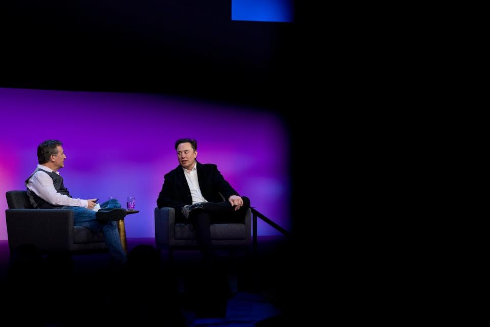 TED CEO Chris Anderson, left, interviews Elon Musk during the last TED 2022 session in Vancouver on April 14, 2022.