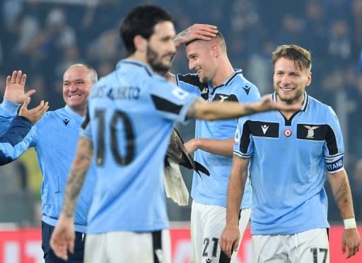 Serie A top scorer Ciro Immobile (R) scored his 27th league goal this season