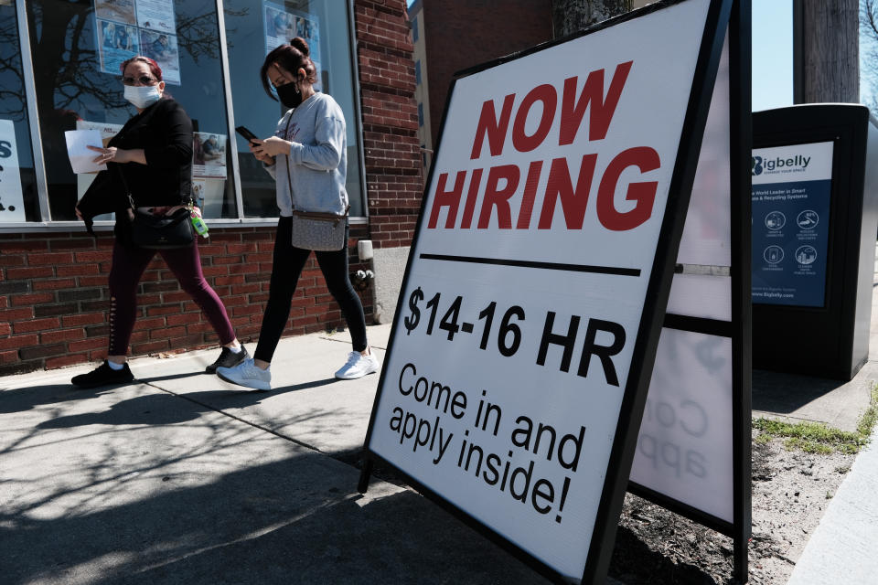 A company advertises a help wanted sign on April 09, 2021 in Pawtucket, Rhode Island. (Photo by Spencer Platt/Getty Images)