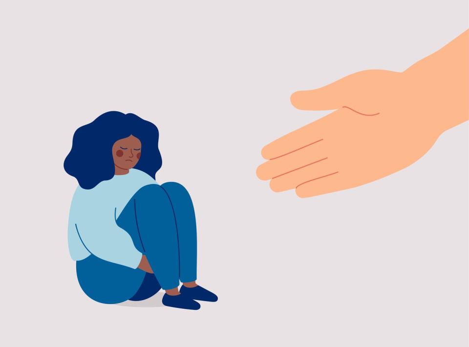 human hand helps a sad black woman to get rid of anxiety the counselor supports the african american girl with psychological problems