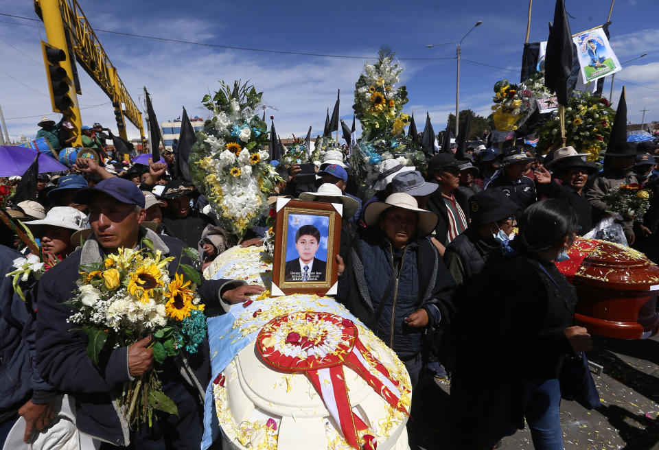FILE - Residents hold a funeral procession for those who were killed amid clashes between security forces and protesters attempting to seize control of an airport in Juliaca, Peru, Jan. 11, 2023. Peru’s unrest, which has left at least 60 dead, was triggered by the impeachment in December of President Pedro Castillo. Demonstrations were first largely concentrated in the south, a region of Peru that felt a particular kinship to Castillo’s humble background as a rural teacher from the Andean highlands. (AP Photo/Hugo Curotto, File)