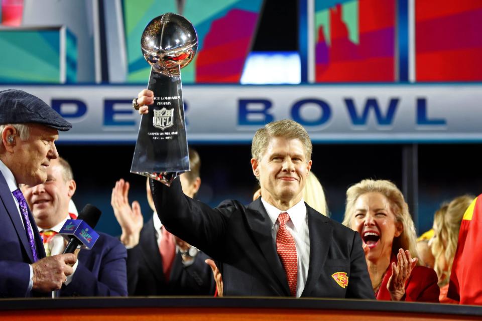 Kansas City Chiefs chairman and CEO Clark Hunt holds the Vince Lombardi Trophy after winning Super Bowl 57.