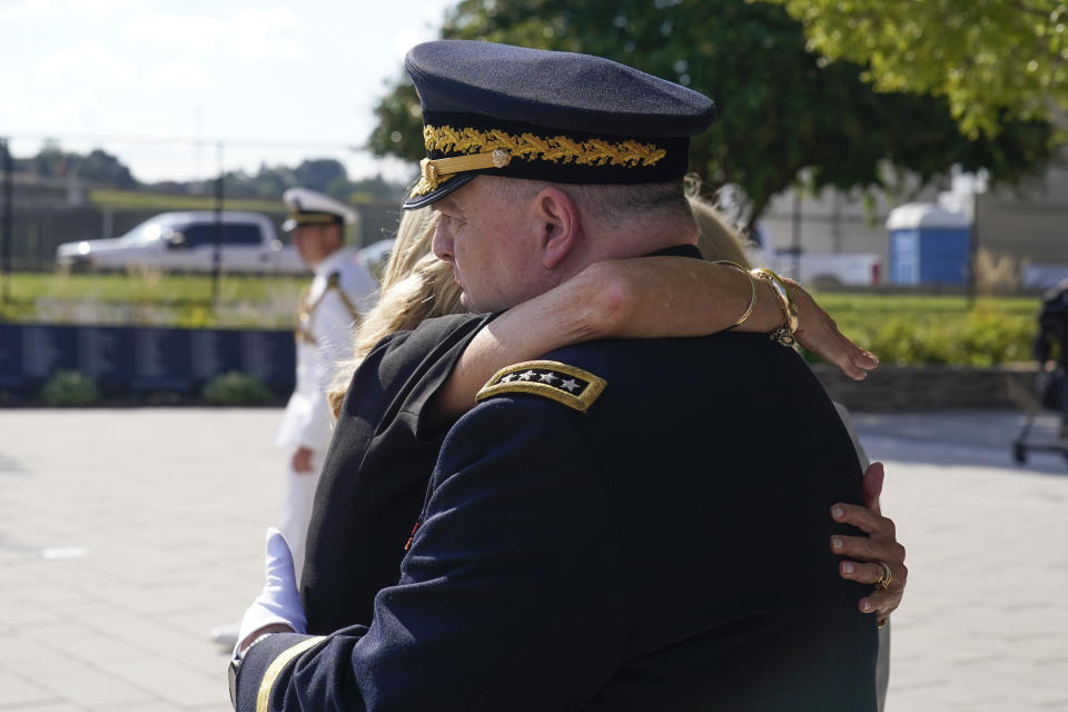 FILE - First lady Jill Biden hugs Chairman of the Joint Chiefs of Staff Gen. Mark Milley after placing a wreath at the National 9/11 Pentagon Memorial on Monday, Sept. 11, 2023, in Washington, in honor of the 184 people killed in the 2001 terrorist attack on the Pentagon. (AP Photo/Alex Brandon, File)