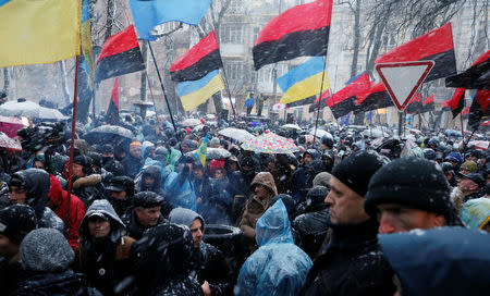 Supporters of former Georgian President Mikheil Saakashvili gather near a temporary detention facility where Saakashvili is being held in custody in Kiev, Ukraine December 10, 2017. REUTERS/Gleb Garanich