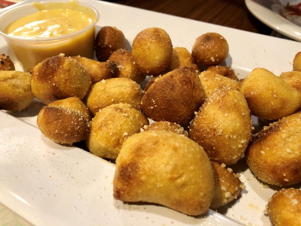 Mellow Mushroom uses its spring-water pizza dough to make pretzels and pretzel bites, shown here with beer cheese.