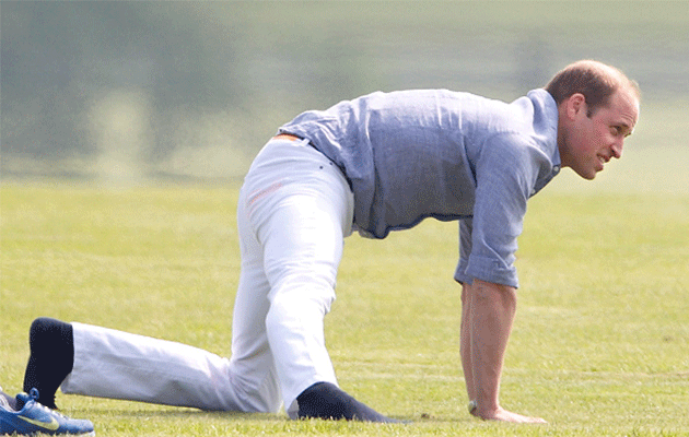 Prince William knows how important stretching is before a match. Photo: Getty Images