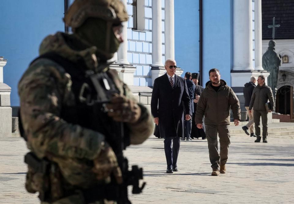 President Biden, left, walks with President Zelensky during the visit on Monday (Reuters)
