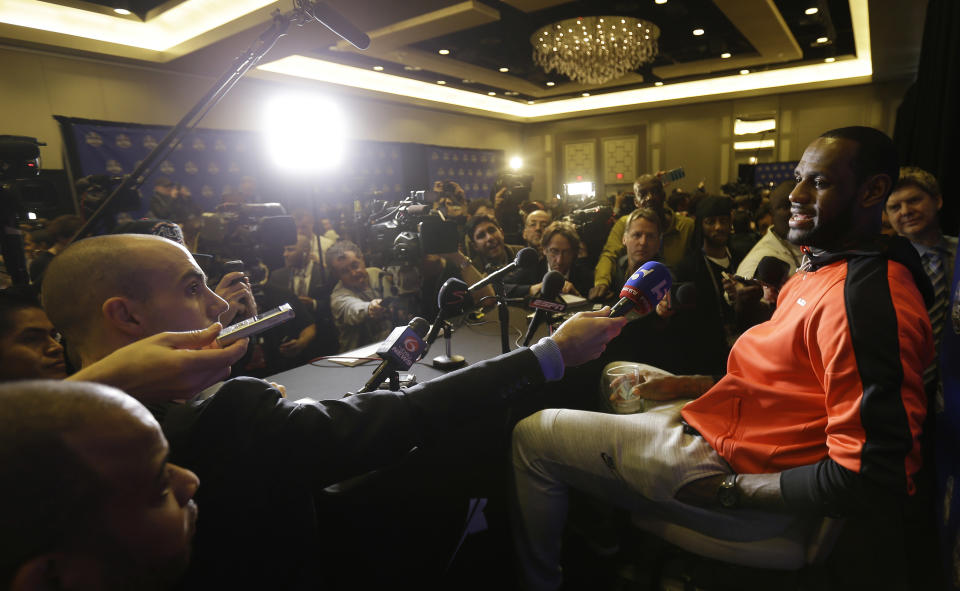 The Miami Heat's LeBron James speaks with reporters during the NBA All Star basketball news conference, Friday, Feb. 14, 2014, in New Orleans. (AP Photo/Gerald Herbert)