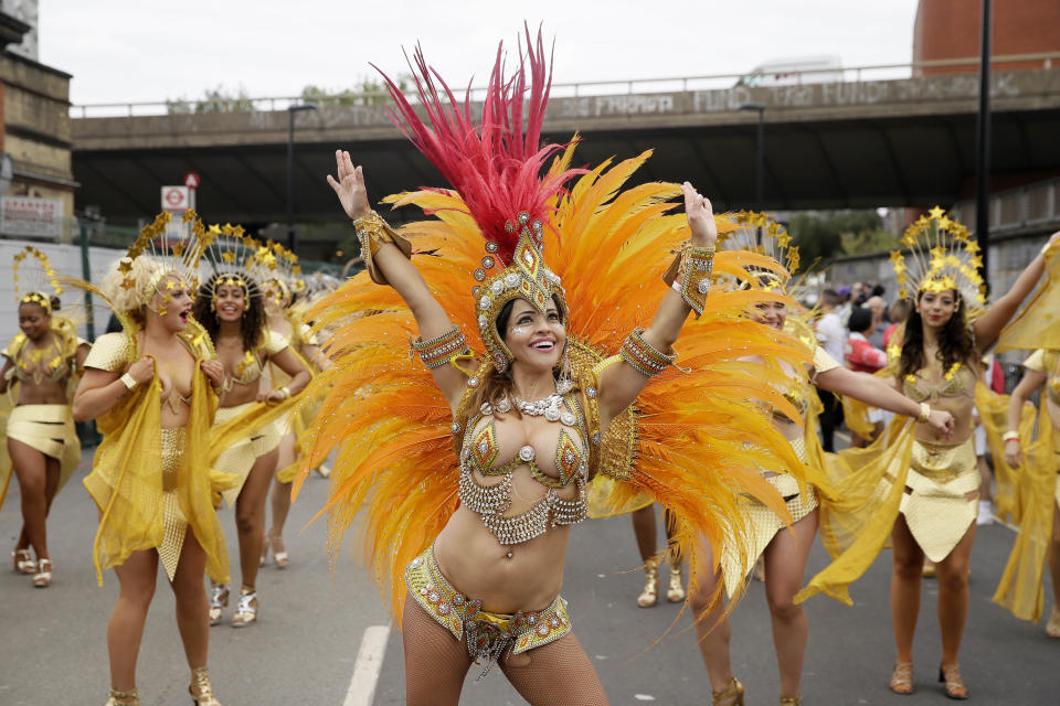 <p>Costumed revellers perform in the parade during the Notting Hill Carnival in London, Monday, Aug. 27, 2018. (Photo: Tim Ireland/AP) </p>