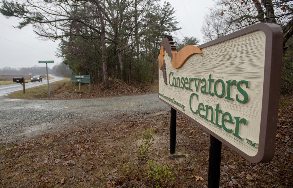 FILE - This Dec. 31, 2018 file photo shows a sign of Conservators' Center at the property near Burlington, N.C. A witness told authorities that a gate blocked by a ball at the North Carolina animal preserve allowed a lion to reach three people cleaning an enclosure and begin a fatal attack, biting one intern’s ankle and pulling her into the enclosure, according to a medical examiner’s report. (Woody Marshall/The Times-News via AP, File)