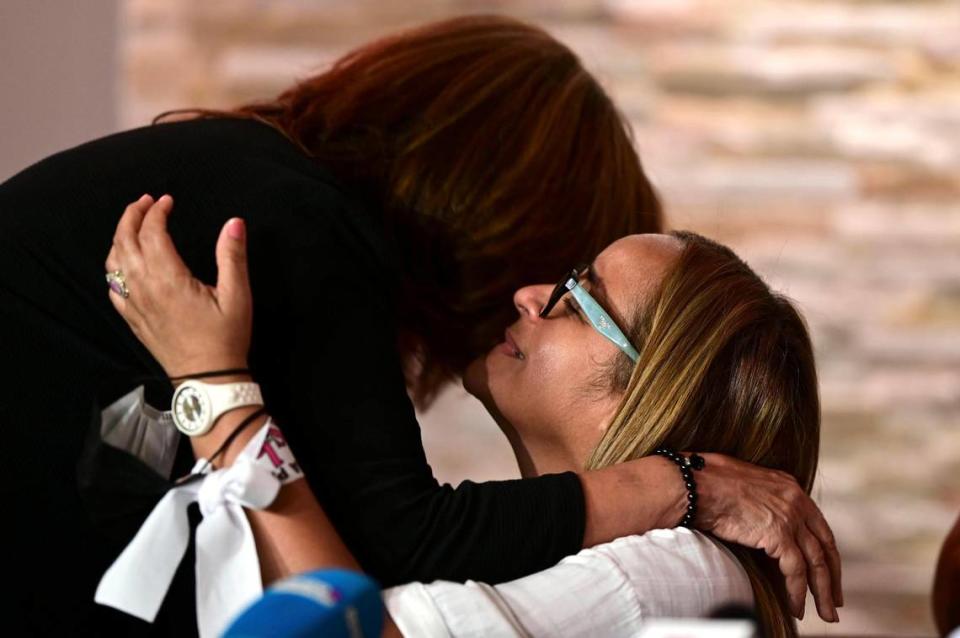 Nitza Rios, left, mother of Arelis Mercado who was brutally murdered twenty months ago, gives support to Keila Ortiz on Thursday, May 6, during a press conference at the wake of her daughter Keishla Rodriguez, whose body was found in a lagoon in San Juan, Puerto Rico.