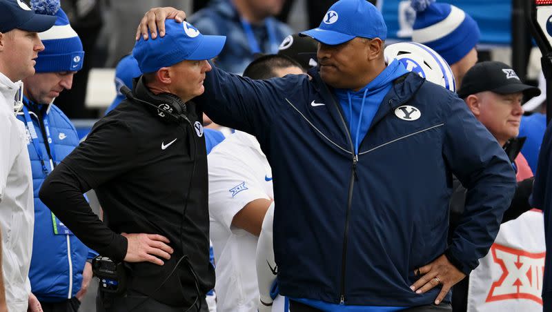 BYU head coach Kalani Sitake puts his hand on defensive coordinator Jay Hill as BYU and Oklahoma play at LaVell Edwards Stadium in Provo on Nov. 18, 2023.