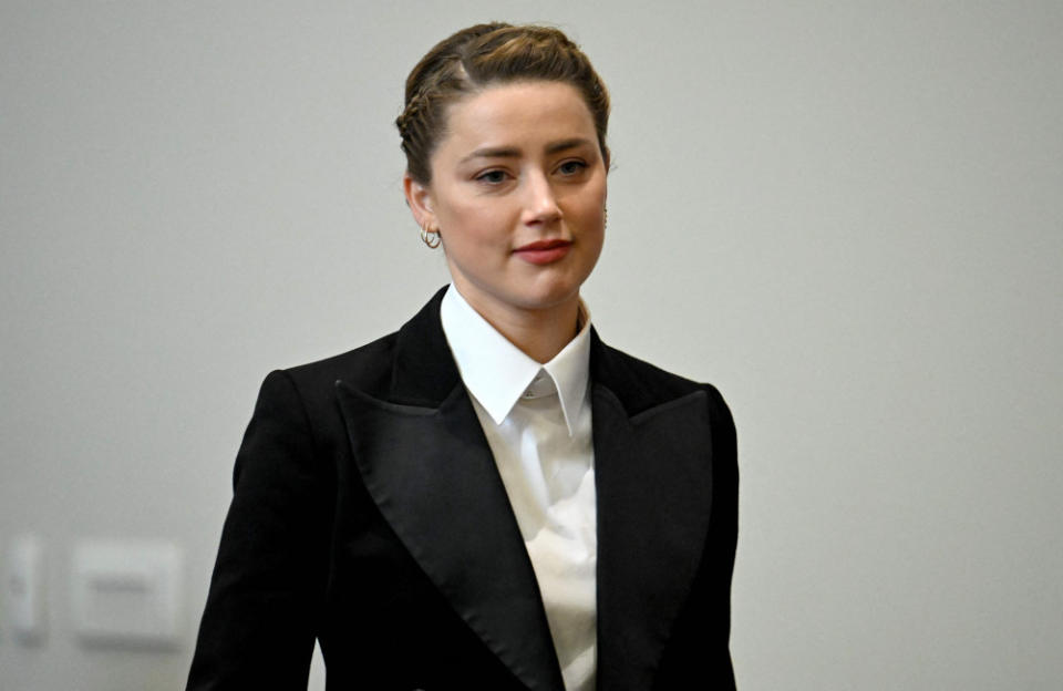Amber Heard wiped away tears during her team’s closing arguments in her bitter defamation case against Johnny Depp credit:Bang Showbiz