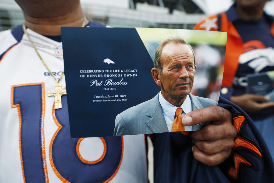 Denver Broncos fan Clinton Mayfield holds up a card to mark the five-hour memorial for team owner Pat Bowlen Tuesday, June 18, 2019 in at Mile High Stadium, the NFL football team's home in Denver. Bowlen, who has owned the franchise for more than three decades, died last Thursday. (AP Photo/David Zalubowski)