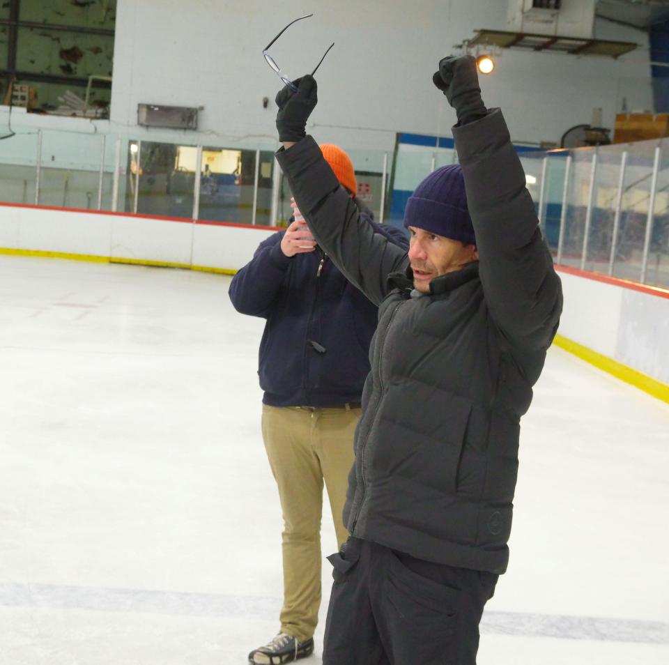 "Shattered Ice" director Alex Ranarivelo gives instructions to the actors on the ice at the Zapustas Arena in Randolph where the movie is being shot on Wednesday, Jan. 24, 2024 in Randolph.