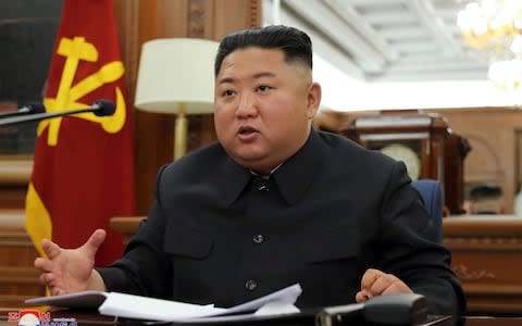  North Korean leader Kim Jong Un speaks during a ruling party meeting - Credit: KCNA