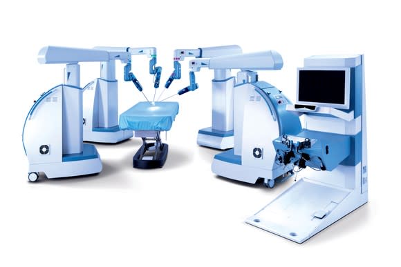 Picture of the Senhance Robotic Surgical arms and console