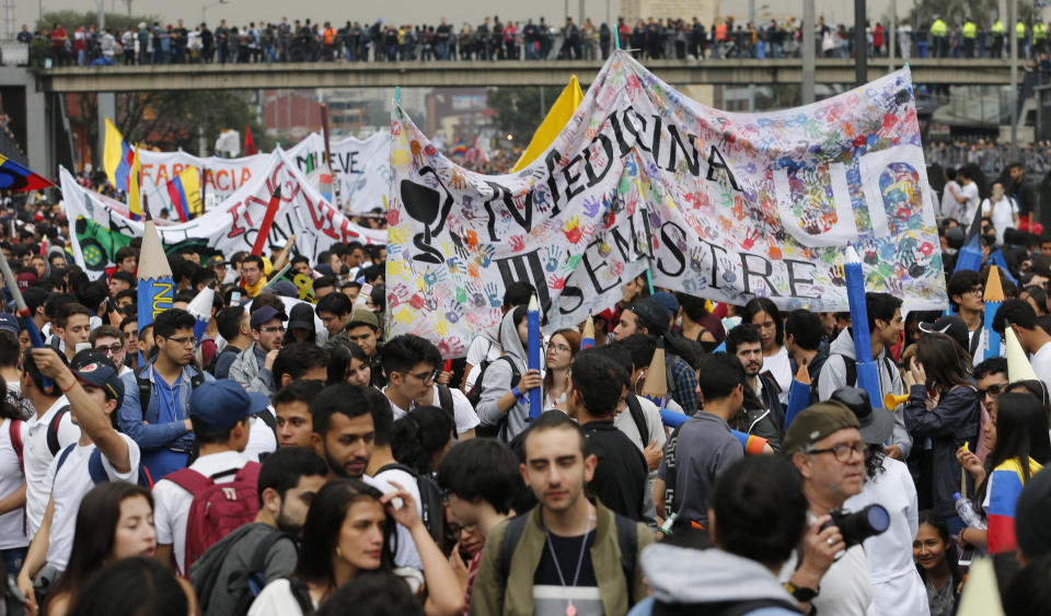 University students march during a protest asking for a hike in the budget for public higher education, in Bogota, Colombia, Thursday, Nov. 15, 2018. The so-called “Pencil March” is the latest in more than a half-dozen street protests in recent months demanding the government step up funding for education. (AP Photo/Fernando Vergara)