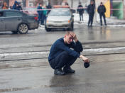 <p>A man reacts at the scene of a fire in a shopping mall in the Siberian city of Kemerovo, March 25, 2018. (Photo: Marina Lisova/Reuters) </p>