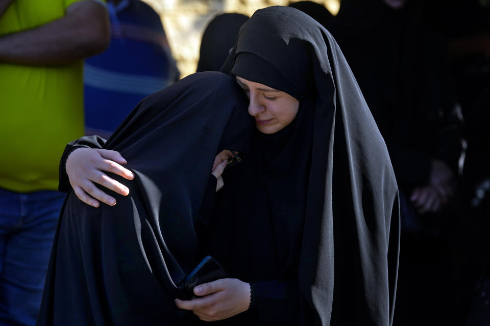 Relatives of Ali Ibrahim Rmeiti, who was killed by Israeli shelling, mourn during his funeral procession in the southern Beirut suburb of Dahiyeh, Lebanon, Saturday, Nov. 4, 2023. (AP Photo/Bilal Hussein)