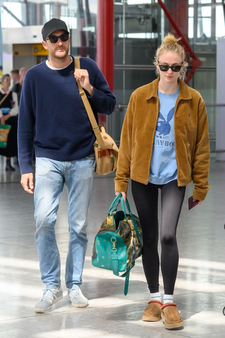 a man and woman walking down the street