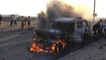 People watch a vehicle which belonged to Shi'ite Muslim rebels burn during clashes in Aden March 26, 2015. REUTERS/Nabeel Quaiti