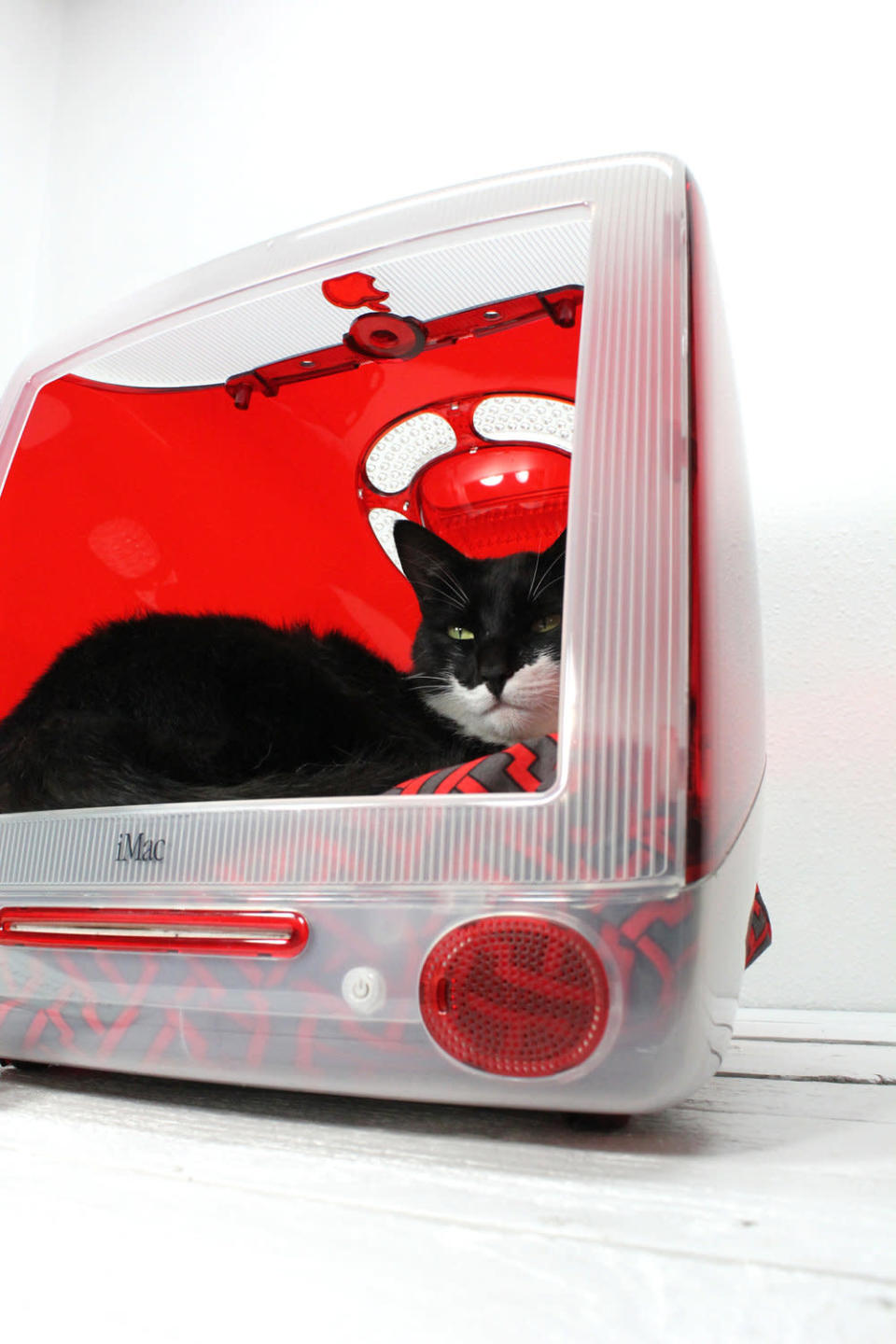 Atomic Attic made this <a href="http://etsy.me/RnelAh" rel="nofollow noopener" target="_blank" data-ylk="slk:red iMac pet bed;elm:context_link;itc:0;sec:content-canvas" class="link ">red iMac pet bed</a> as well as the previous blue one. Aqua, lime, orange and clear casings are also available. (If you're counting up the 12 pet beds mentioned in the headline, we're calling this and the previous iMac a single pet bed because they're so similar.)