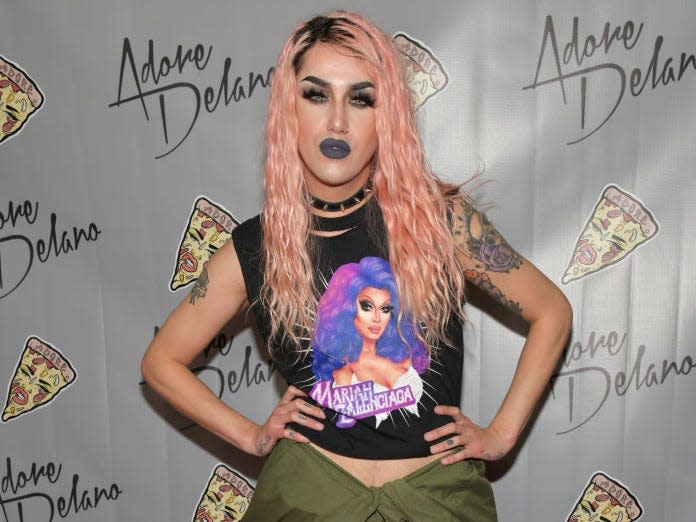 Adore Delano in a pink wig and black t shirt