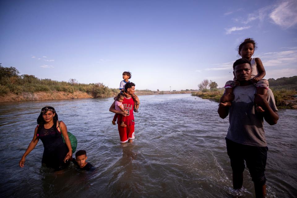 Migrants search for a safe place without strong currents as they cross the Rio Grande River into the U.S. in Eagle Pass, Texas on July 20, 2023, from Piedras Negras, Coahuila, Mexico. The migrants were part of a group of nearly 30 migrants who crossed hoping to seek asylum in the U.S. 