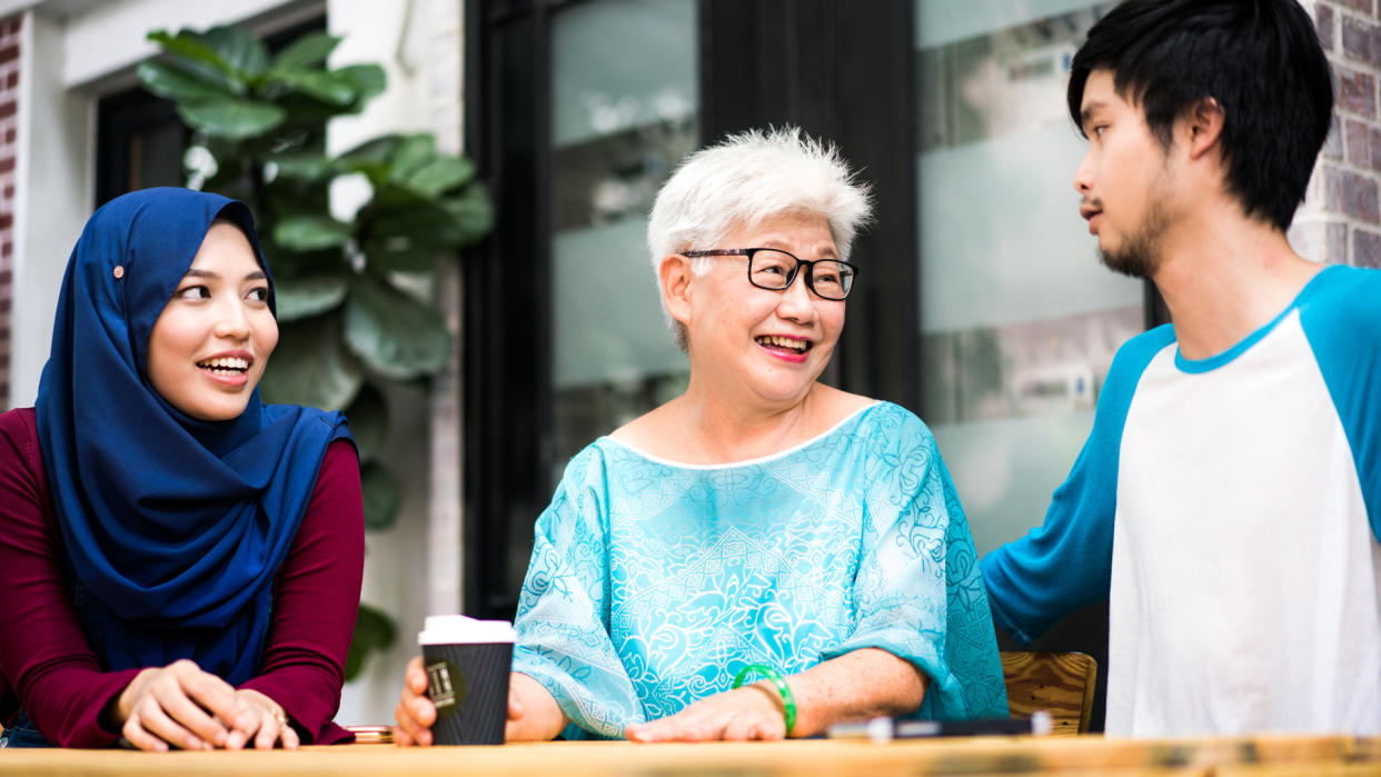 Senior woman talking happily with her grandchildren.