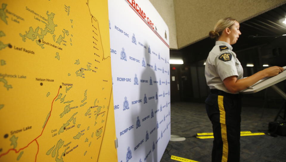 Royal Canadian Mounted Police Cpl. Julie Courchaine speaks to media about the ongoing RCMP search in Gillam, Manitoba, for the British Columbia murder suspects Bryer Schmegelsky, 18, and Kam McLeod, 19, in Winnipeg, Manitoba, Friday, July 26, 2019. Authorities are urging "all Canadians" to be on the lookout for the suspects. (John Woods/The Canadian Press via AP)