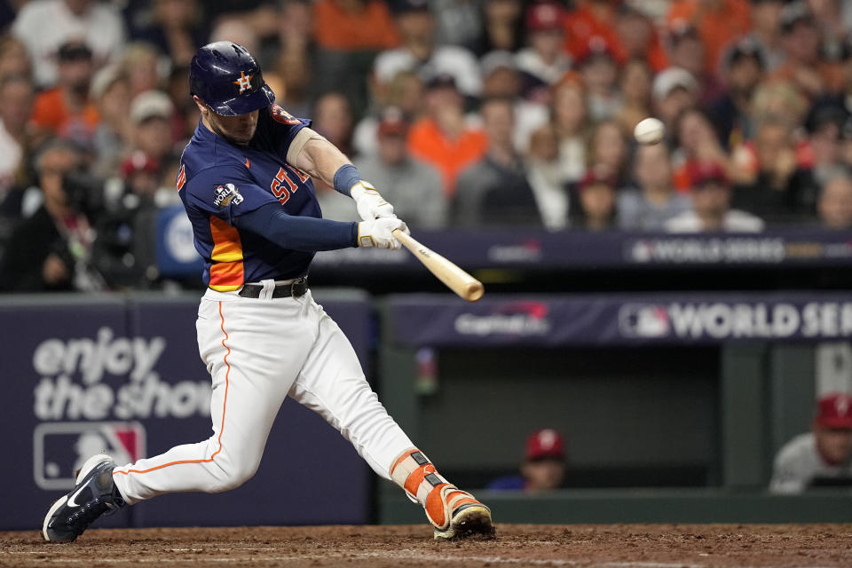 Houston Astros' Alex Bregman hits a two-run home run during the fifth inning in Game 2 of baseball's World Series between the Houston Astros and the Philadelphia Phillies on Saturday, Oct. 29, 2022, in Houston. (AP Photo/David J. Phillip)