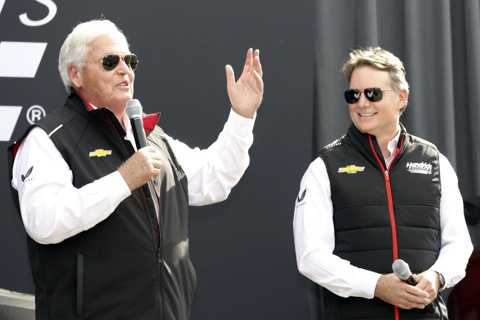 Team owner Rick Hendrick, left, and Jeff Gordon, right, speak at a news conference before a NASCAR Daytona 500 auto race at Daytona International Speedway, Thursday, Feb. 15, 2024, in Daytona Beach, Fla. Hendrick Motorsports is celebrating 40 years in racing. (AP Photo/Terry Renna)