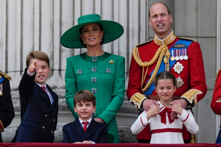 FILE – Prince William, right, Kate, Princess of Wales, centre, Princess Charlotte, bottom right, Prince George, left, and Prince Louis greet the crowd from the balcony of Buckingham Palace after the Trooping The Colour parade, in London, Saturday, June 17, 2023. The Princess of Wales has been hospitalized for planned abdominal surgery and will remain at The London Clinic for up to two weeks, Kensington Palace said Wednesday, Jan. 17, 2024. (AP Photo/Alastair Grant, file)