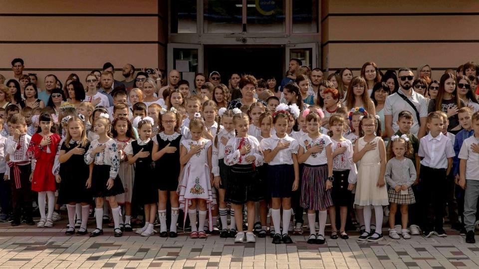 PHOTO: Pupils sing Ukraine's national anthem to mark the start of the new school year, known as the 'Day of Knowledge' in Irpin, northwest of Kyiv, Sept. 1, 2023, amid the Russian invasion of Ukraine. (Roman Pilipey/AFP via Getty Images)