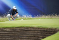 Spain's Jon Rahm looks at a put on the 15th green during the third day of the British Open Golf Championships at the Royal Liverpool Golf Club in Hoylake, England, Saturday, July 22, 2023. (AP Photo/Jon Super)
