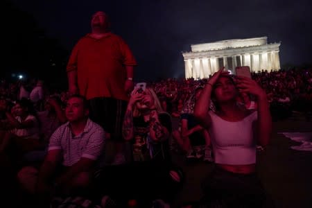 FILE PHOTO: People watch fireworks during the 4th of July Independence Day celebrations at the National Mall in Washington