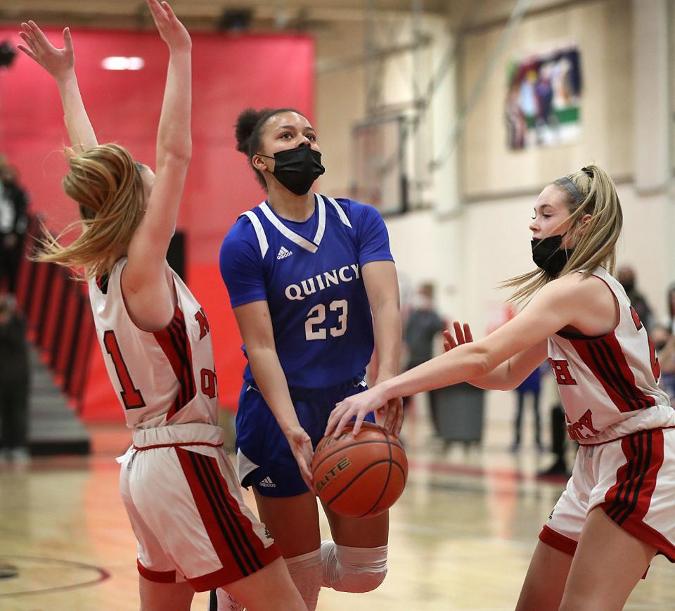 Quincy's Lena Waldron has the ball stripped from her on a layup attempt against North Quincy on Friday, Jan. 21, 2022.