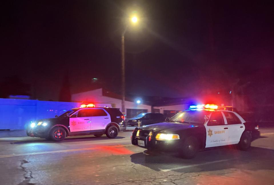 Sheriff's deputies arrive at the early morning street takeover in East Compton.