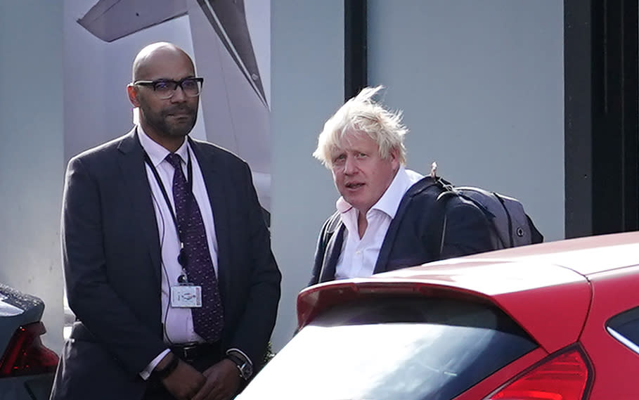 Former Prime Minister Boris Johnson arrives at Gatwick Airport in London, after travelling on a flight from the Caribbean, following the resignation of Liz Truss as Prime Minister. Picture date: Saturday October 22, 2022.